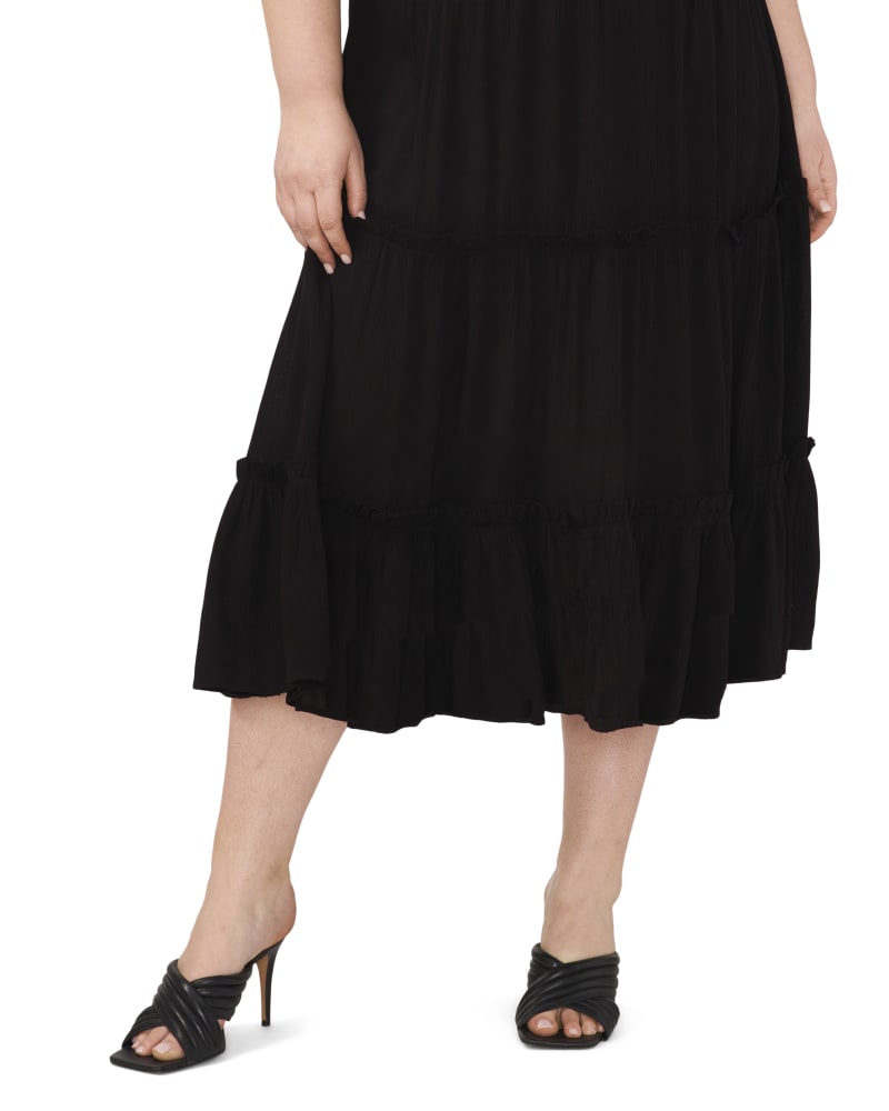 Front of a model wearing a size 1X TIERED PULL ON MAXI SKIRT in RICH BLACK by Vince Camuto. | dia_product_style_image_id:304525